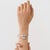 This double-headed serpentine bangle bracelet is crafted in 925 sterling silver and features two sculpted serpent heads...