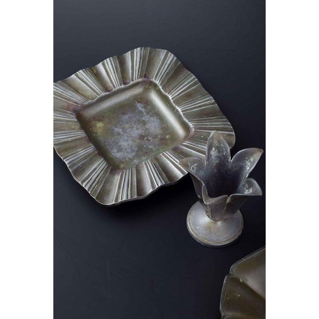 Just andersen (1884–1943) vase and two ashtrays in pewter. Vase in the shape of a tulip. H. 8.5 cm, d. 6.5 cm. Ashtrays...