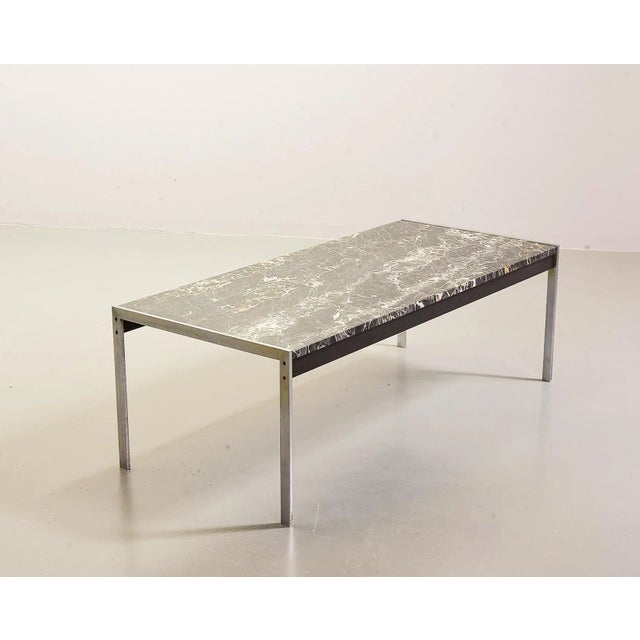 Rare dramatic veined black marble coffee table is part of the 020 series designed by Kho Liangh Ie for Artifort in the...