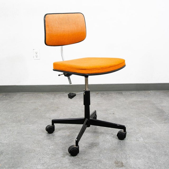 Unique and well made Danish task chair by Jorgen Rasmussen for Labofa in orange. Clean and classic look. Iconic modern...