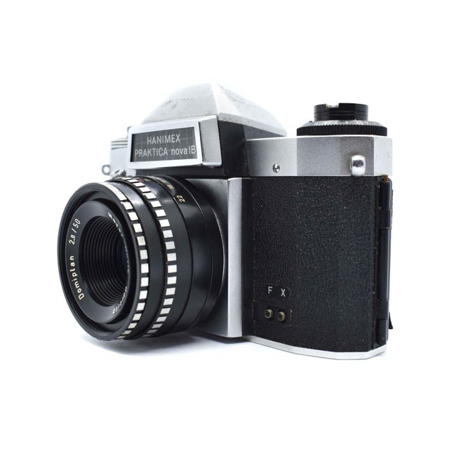 Evoke the nostalgia of the golden age of film with this striking Hanimex Praktica nova IB 35mm SLR camera. Manufactured in...
