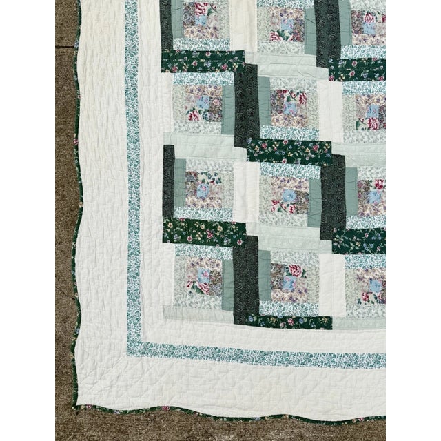 Vintage hand stitched quilt with a log cabin design, from an Ohio estate.