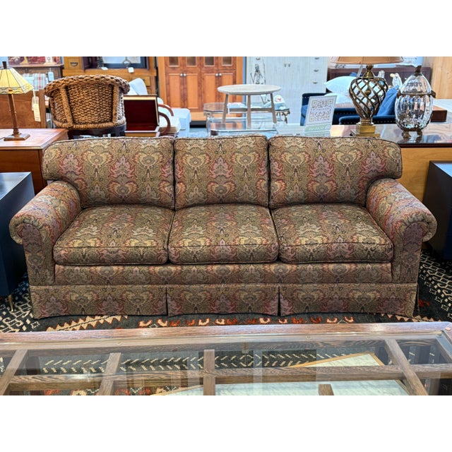 Design Plus Gallery presents a Rolled Arm Paisley Sofa from Henredon. Traditional style with the rolled arms, skirt front...