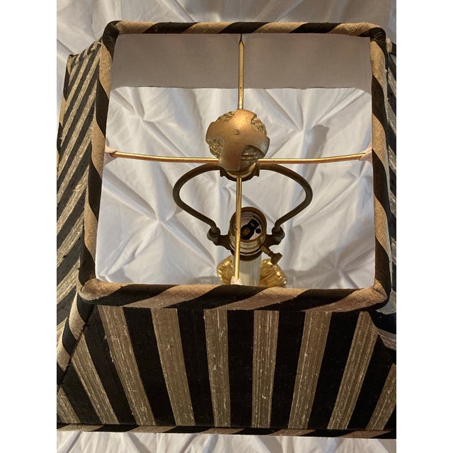 Style plastic and metal tall lamp with striped pleated shade. Gorgeous fabric and lamp details one of a kind decor look.