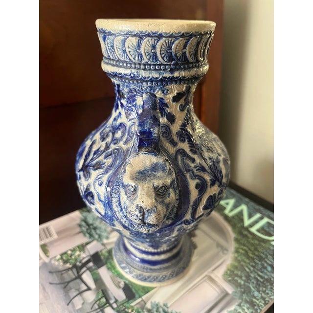 German blue and white base with Lion heads handles and birds. Made in the Late 19th Century