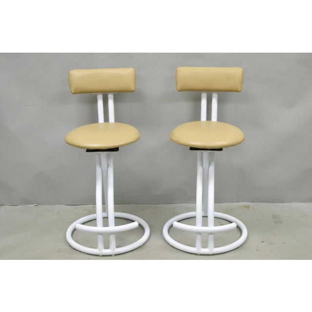 Vintage Postmodern Memphis Style White Tubular Metal Swivel Bar Stools by Cal-Style - a Pair. Circa Late 20th Century....