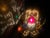 The Fairy Lamp features ornate pierced scrollwork set with large, faceted glass cabochons in various colors on a ruffled...