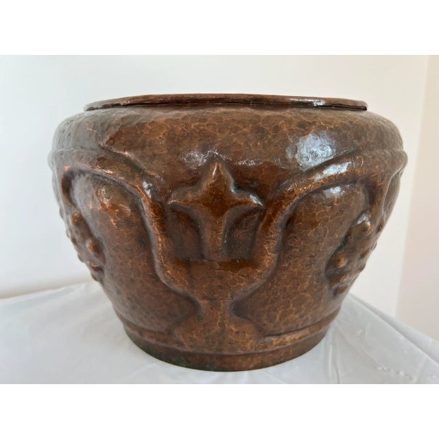 In the early 1900's, Stickley Brothers made a few different patterns and sizes of hammered copper Jardinaires. This...