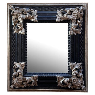 Dessin Fournir Italian Baroque Style Ebonized and Giltwood Mirror For Sale