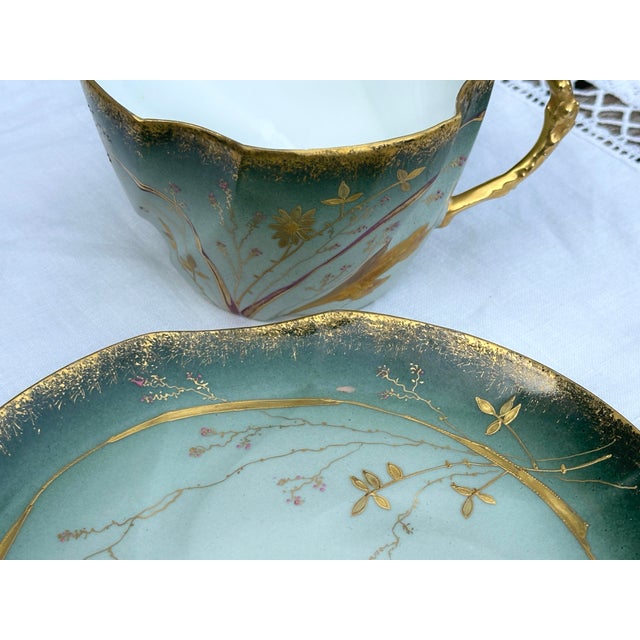 Rare: Polylobed chocolate cup and saucer in fine translucent porcelain or eggshell, delicate hand-painted floral...
