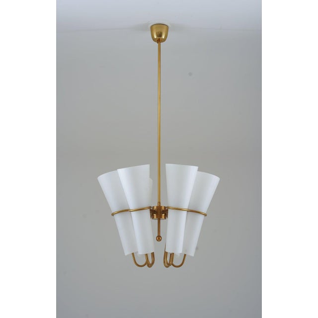 Very rare chandeliers by Hans-Agne Jakobsson, manufactured by Arnold Wiig Fabrikker, Norway. These magestic lamps features...