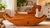This beautifully handcrafted cherry wood rocking horse has an expressive face, a carefully carved mane, and leather ears...