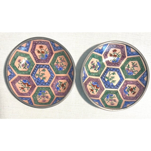 Clean, elegant Neiman Marcus decorative set featuring floral Asian-inspired plates and bowls with pewter and ceramic...