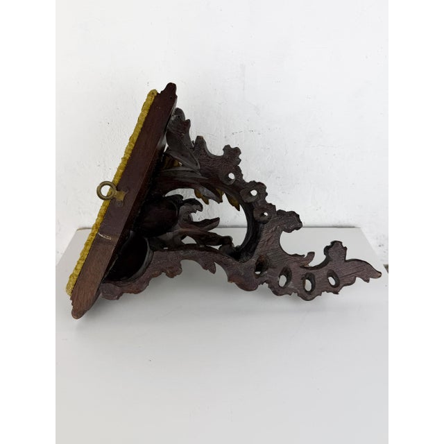 Antique hand-carved wooden wall console shelf featuring an elegant Rococo-inspired design with richly scrolling acanthus...