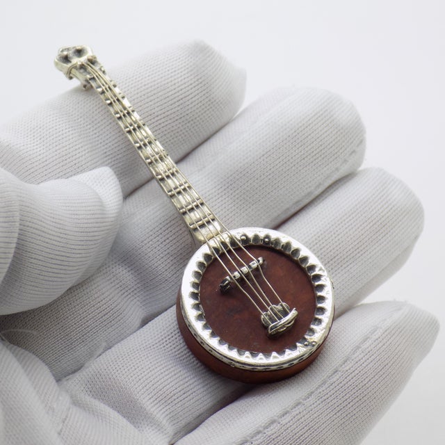Vintage miniature with musical charm and true handcrafted character, depicting a mandolin, handmade in Italy between the...
