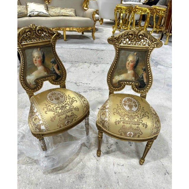 Elevate your home décor with this exquisite French Rococo accent chair. Fully refinished with radiant gold leaf, it...