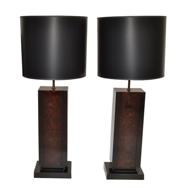 Pair of large and heavy Maison Lancel table lamp in patinated brass and black lacquered wood base. Decorative Glass in...