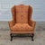 This is an authorized Colonial Williamsburg furniture reproduction by Kittinger Company of a New England wingback easy...