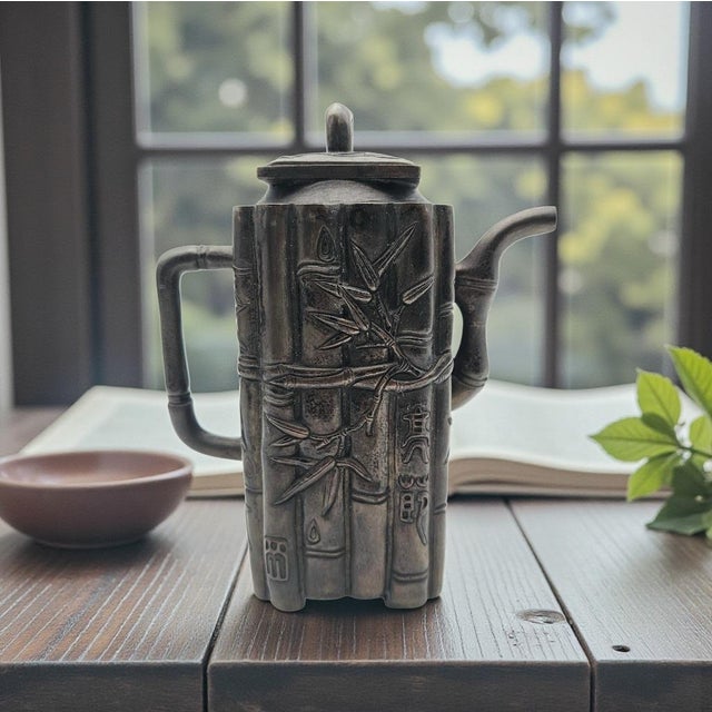 This vintage cast metal teapot is shaped in the traditional Chinese bamboo motif, a form long associated with scholar’s...
