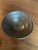 A pair of American studio stoneware coups in the Arts & Crafts style. Deep brown glaze with copper metallic overtones....
