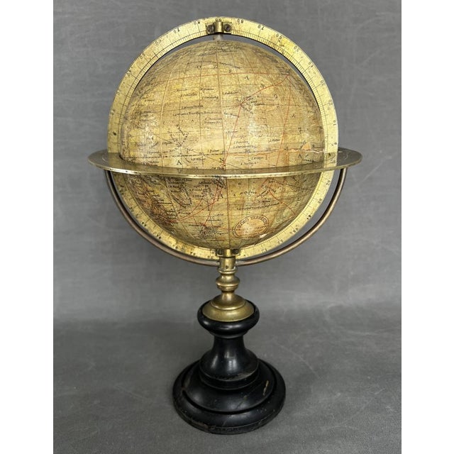 Faustino Paluzie, Earth globe from the late 19th century. Stucco globe with lithography. stucco, bronze and wood. . total...