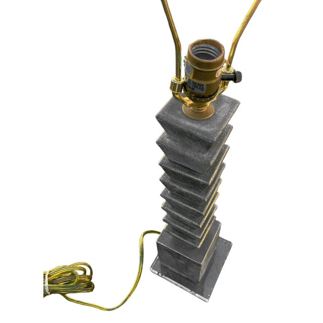 A beautiful 1980s postmodern grey and black stone/marble table lamp on a lucite base. Lamp is in good and working...