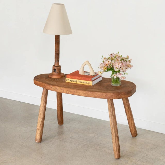 Great chunky oak wood console table from France, 1970's. Large organic oval shaped top, with four hand carved legs that...