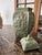 This lidded vase is vintage 1980s. There are four panels with two alike, plus the other two are alike. The surface has a...
