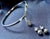 A high-quality white gold bundle of 585 white gold open bangle with 7 brilliants and 585 white gold stud earrings with 6...