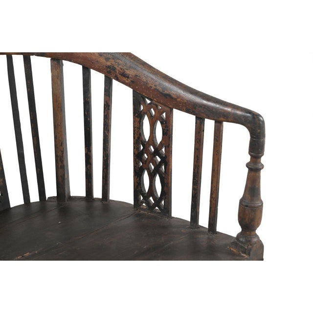 This Vintage Anglo-Indian Teakwood Armchair is handcrafted from solid teakwood, featuring a graceful curved back, turned...