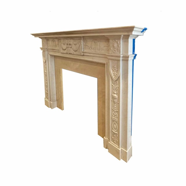 Vintage, mid century English carved statuary marble mantel. Highly ornamented with urns, swags, ribbons, rams and natural...