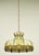 Vintage stained glass pendant light in a mixed tan and white color scheme with an antique brass chain. This requires one...