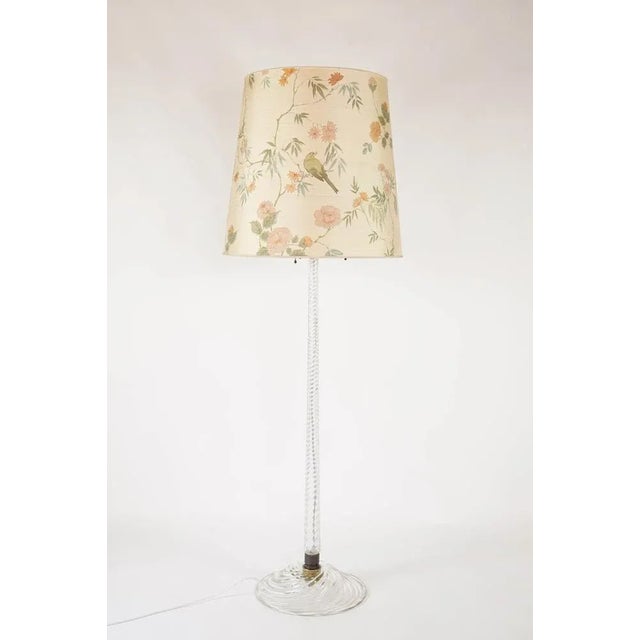 An elegant Venini Murano glass floor lamp designed by Carlo Scarpa. This high end floor lamp has a ribbed, ‘costelature’...