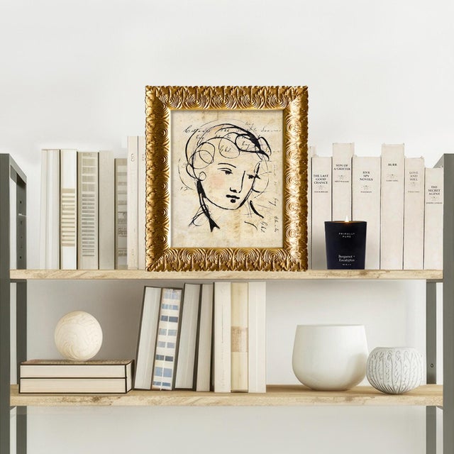 Reproduction print of a gestural figure on vintage ledger paper, framed. This print is from our archive of vintage...