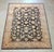 Pak Oushak hand-knotted wool rug, measuring approximately 9’ x 12’5”. The rug features a rich black field filled with an...