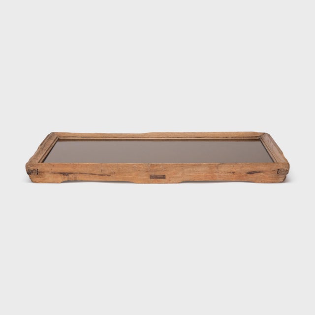Dovetail joinery and a beveled trim add charming detail to the simple lines of this century-old Chinese tea tray. The...