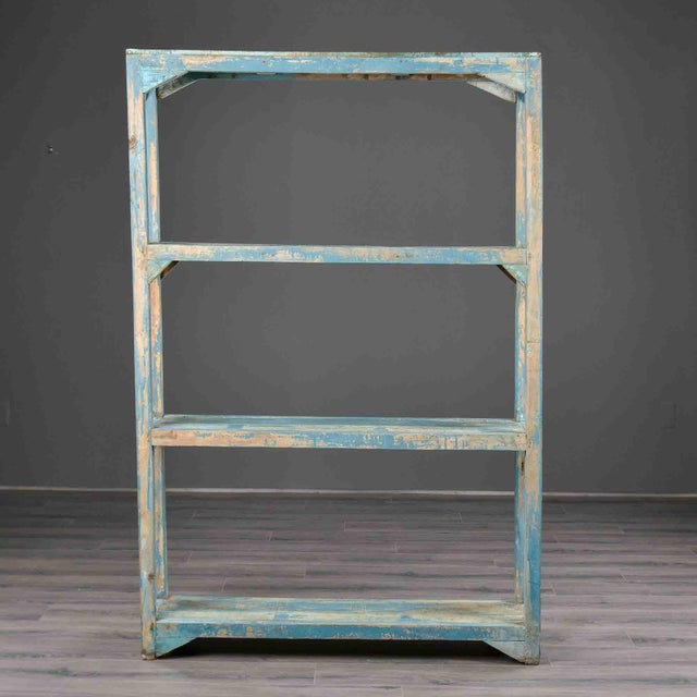 This open étagère is constructed in pine with four square-section corner uprights supporting three intermediate shelves...