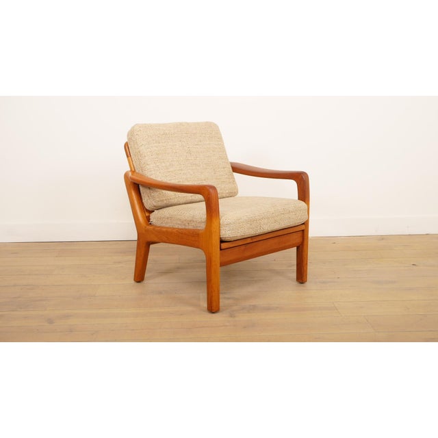 Beautiful vintage teak armchair, designed in the 1960s by Juul Kristensen, in distinctive Danish style. This stylish...
