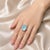 Elegant 14K white gold cocktail ring featuring a natural cabochon aquamarine 8.6 carats accented with brilliant round...