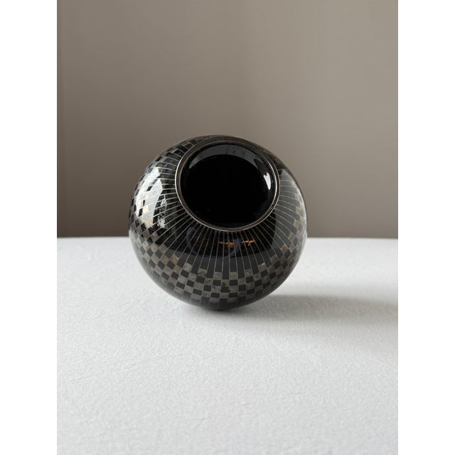 Elegant decorative vase made of black hyalith (opaque) glass, designed in the Art Deco style. The surface is hand-...