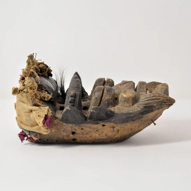 An ornate Dan Guerre Guere Mask from Cote d'Ivoire. Featuring characteristics typical of Dan Guerre Guere art, like the...
