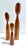 A sculptural set of three signed Danish teak candle holders with elongated turned forms and asymmetrical tulip-shaped...