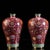 This exquisite pair of Meiping vases features vibrant cloisonné enamel work on a gilt bronze body. Each vase is...