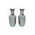 This pair of Chinese Famille Rose porcelain vases features a classic baluster form with flared rims and stylized red lion-...
