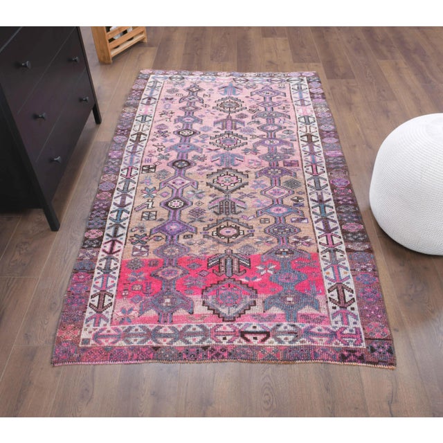 Vintage Turkish Hand-Knotted vintage rug is a semi-Vintage area rug.'70s Eastern region of Turkey's unique rug is...