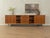 Unique, partially solid sideboard in Scandinavian style from the 1950s. Walnut veneer body with four sliding doors, two...