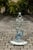 A French cast iron painted umbrella stand with dog motif from the early 20th century with enameled tray. This early 20th-...