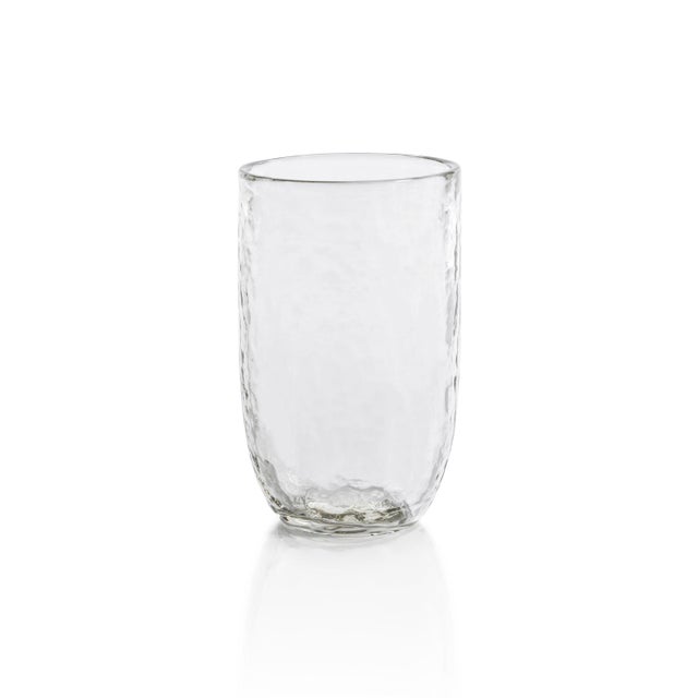 Upgrade your drinkware collection with this set of four Hammered Highball Glasses, perfect for enjoying your favorite...