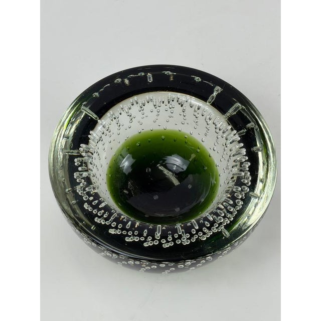 Small Murano glass bowl in deep green sommerso glass with bullicante decoration, designed by Galliano Ferro in Italy...