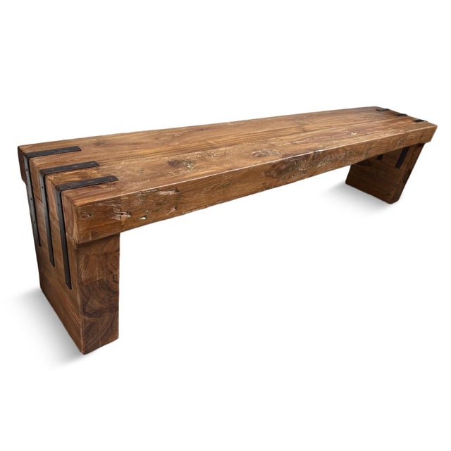 Simple salvaged teak wood bench with black iron strap details on seat edge corners and legs. Smooth finish with beautiful...